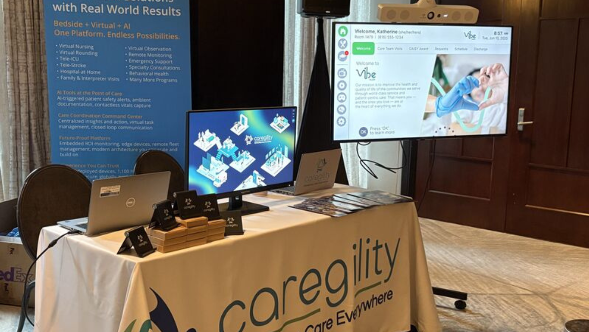 Caregility virtual care booth with monitors and digital health displays